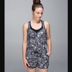 Lululemon The Runsie Flowabunga Black Angel Wing/Black Floral Romper
